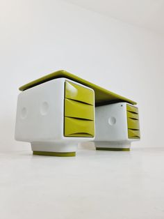 a white and green desk with two drawers