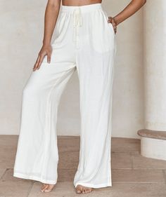 Beige Wide-leg Drawstring Pants, Chic Linen Wide Leg Pants With Drawstring, Cream Drawstring Pants For Loungewear, Chic Wide Leg Pants With Drawstring In Relaxed Fit, Chic Beach Wide Leg Pants With Drawstring, Bohemian Drawstring Bottoms For Beach Season, Chic Wide Leg Beach Pants With Drawstring, Beach Straight Pants With Drawstring, Beach Drawstring Straight Pants