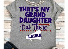 a gray shirt that says, that's my grand daughter out there laura