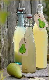 three bottles filled with liquid sitting on top of a table next to a green apple