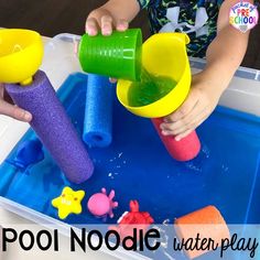 a child is playing with water play toys