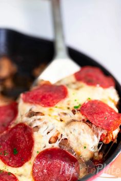 a slice of pepperoni pizza in a skillet