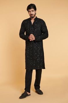 Black kurta with striped pattern sequins embroidery. Comes with pant.
Component: 2
Pattern: Embroidered
Type Of Work: Sequins
Neckline: Mandarin Collar
Sleeve Type: Long
Fabric: Blended Linen
Color: Black
Other Details: 
Side slit kurta
Stripped pattern work
Occasion: Sangeet - Aza Fashions Black Sequin Kurta Men, Striped Kurta, Stripped Pattern, Black Kurta, Kurta Men, Kurta Set For Men, Strip Pattern, Linen Color, Black Sparkle