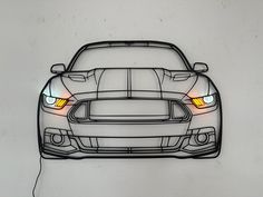 a drawing of a sports car with its headlights turned on and the front lights glowing