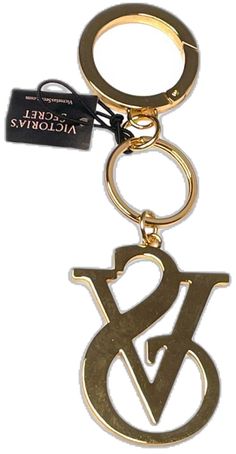 a gold key chain with the letter b and w on it