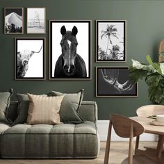 a living room with green walls and pictures hanging on the wall, including a couch