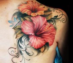 a woman's back with flowers and butterflies on it