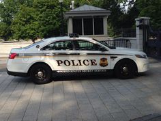 a police car parked in front of a building