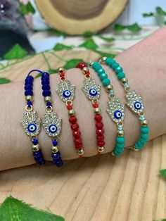 This listing is for one Crystal Beaded Rhinestone Hamsa Shambala String Bracelet. These bracelets are adjustable and can be worn on any wrist size. This bracelet is available in 3 different colors for you to choose from: Red, Teal, and Dark Blue. The Hamsa Hand is a symbol of spiritual protection. Dating back thousands of years and seen in many different cultures, the Hamsa Hand is known to protect it's user and bring good luck, health, and happiness. **Due to the unique nature of each stone, your item may vary slightly from the picture shown. All items are cleansed with white sage before being shipped. Any comments, questions, or concerns feel free to contact me, I am here to help! Teal And Dark Blue, Shambala Bracelet, Belly Beads, Clay Birds, Hand Of God, Spiritual Protection, Unique Nature, White Sage, Stretchy Bracelets