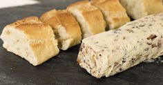 several different types of bread on a table