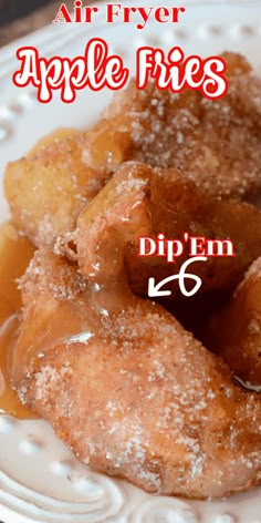 an image of apple frittes on a plate with caramel syrup and powdered sugar