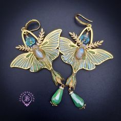 Luna Moth opal earrings with shimmers wings, made from high-quality colourful polymer clay, colours do not wash out and do not fade in the sun, decorated by Moonstone cabochons, Swarovski crystals and glass beads. Single copy,100% Handmade OOAK earrings. All items are shipped from my home within 1-3 business days after payment confirmation. Please, contact me with any questions. I make some custom orders. If you would like some items to be custom made or created for you in a special way, feel free to send an Etsy conversation with your requirements, and we can discuss them. Bohemian Resin Jewelry With Matching Earrings, Handmade Green Fantasy Jewelry, Green Bohemian Polymer Clay Jewelry, Whimsical Green Czech Glass Earrings, Whimsical Green Jewelry, Iridescent Bohemian Earrings As Gift, Iridescent Bohemian Earrings For Gifts, Handmade Bohemian Iridescent Earrings, Bohemian Handmade Iridescent Earrings