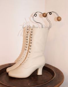 Victorian Boots With Leather Sole For Formal Wear, Victorian Formal Boots With Leather Sole, Formal Victorian Boots With Leather Sole, Historical Formal Boots With Round Toe, Historical Round Toe Formal Boots, Historical Round Toe Boots For Formal Occasions, Victorian Almond Toe Fitted Boots, Vintage Fitted Closed Toe Heeled Boots, Cream Round Toe Wedding Boots