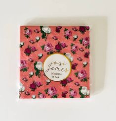 a pink flowered notebook with the words rose jones written in gold lettering on it