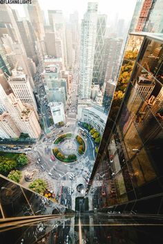 an aerial view of a city with tall buildings