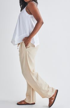 A bump-friendly smocked waist adds to the everyday comfort of wide-leg pants made from lightweight and breathable linen. 29" inseam; 20" leg opening; 12 1/2" front rise; 13" back rise Smocked waist with drawstring Side-seam pockets 100% linen Machine wash, tumble dry Imported Linen Pull-on Style Bottoms For Loungewear, Vacation-ready Straight Leg Harem Pants With Relaxed Fit, Vacation Harem Pants With Relaxed Fit And Straight Leg, Relaxed Fit Straight Leg Harem Pants For Vacation, Effortless Linen Pants With Elastic Waistband, Comfortable Linen Bottoms With Elastic Waistband, Chic Relaxation Pants For Spring, Versatile Beige Linen Bottoms, Neutral Linen Beach Bottoms