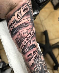 a man with a tattoo on his arm that has some words written in different languages