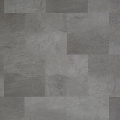 a tile floor with different shades of gray