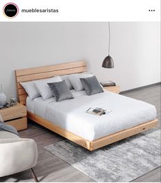 a large bed sitting on top of a wooden floor