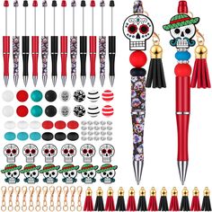 the contents of a pen and its accessories are arranged on a white background, including skull decorations