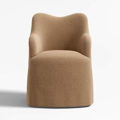 an upholstered chair is shown in front of a white background and the seat has a rounded shape