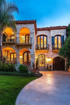 Luxury villa with arched balconies and glowing lights. Embark on a whirlwind tour of luxurious abodes where opulence meets whimsy, leaving you green with envy and ideas for your next home upgrade.