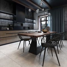 a dining room table and chairs in front of a window