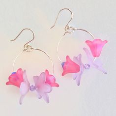 "Lavender pink lucite flower orchids and Swarovski Crystals dangle from handmade Sterling silver hoop earrings. Darling 20mm lavender and 14mm bright pink lucite flowers hang on Sterling silver 1\" hoops accented with 6mm fuchsia AB and little 4mm violet Swarovski Crystals. They move freely on the silver so give off lots of sparkle. Handmade hoops and French ear wires are all made in .925 Sterling silver. Total drop length to edge of petals is 2\" Very lightweight and fun for spring!" Whimsical Pink Flower-shaped Jewelry, Pink Whimsical Jewelry With 3d Flowers, Orchid Earrings, Aquamarine Earrings, Pink Orchids, Sterling Silver Hoop Earrings, Handmade Copper, Sterling Silver Hoops, March Birth Stone