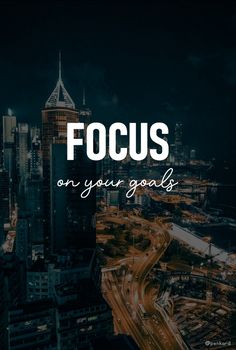 the words focus on your goals in front of an image of a cityscape