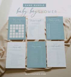 a baby shower game is shown on top of a bed with the names and numbers