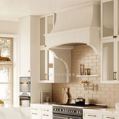 a stove top oven sitting inside of a kitchen next to white cabinets and counter tops