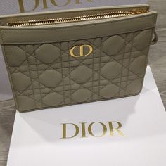 Brand New, Never Used, Pristine Condition. Ships With Box. Crafted In Beige Supple Calfskin, It Stands Out With Its Hallmark Cannage Stitching And A Cd Signature On The Front. The Dior Caro Zipped Pouch Without Chain Combines Modern And Functional Design With The House's Codes Of Elegance. The Pouch Can Be Carried By Hand, Worn Over The Shoulder Or Crossbody, And Pairs Well With Other Pieces From The Same Line. Cd Signature On The Front Three Compartments, One Zipped 6 Card Slots Made In Italy, Designer Clutch With Zipper Pouch, Christian Dior Logo, Canvas Clutch, Envelope Bag, Mini Pouches, Purse Styles, Engraved Logo, Zip Pouch, Nylon Bag