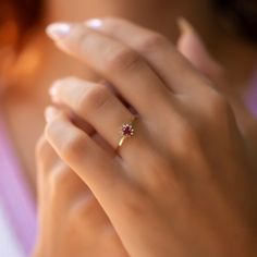 a woman's hand with a ring on it