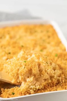 a casserole dish with a wooden spoon in it