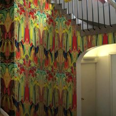 an artistic wallpaper design is featured on the staircase