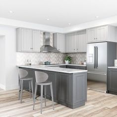 a kitchen with gray cabinets and white counter tops