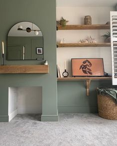 a living room filled with furniture and a mirror on top of a fireplace mantel