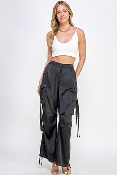 STYLED BY ALX COUTURE MIAMI BOUTIQUE Black Satin Utility Cargo Pants Casual Straight Leg Satin Pants, Casual High Waist Satin Bottoms, Casual Satin Straight Leg Pants, High Waist Satin Pants In Casual Style, Casual High Waist Satin Pants, Casual High-waisted Satin Pants, Casual Satin Trousers, Satin Long Pants With Pockets, Trendy Nylon Cargo Pants With Pockets