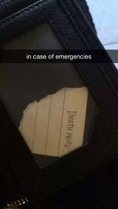 a piece of paper that is inside of a black purse with the words in case of emergency written on it