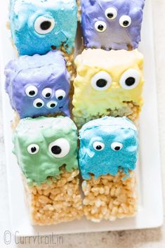 some food with eyes on it and rice krispy treats in the shape of monsters