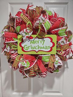 Be prepared to impress your guests this holiday season! This wreath will make a great statement on your door and will turn heads! The finishing touch to your fun Christmas decor! Made on a work wreath form with 2 10nch wide foil mesh,6 coordinating ribbons, deco flex tubing and a Grinch tin sign complete this amazing wreath! This wreath is for indoor and outdoor use. If placed outside it's best to have some overhead cover of some sort so it's not soaked with rain, or direct sunlight.  Make sure to "favorite my shop" so you can see my new wreaths in your Etsy feed! Thank you so much for stopping by and looking around. If you have any questions please don't hesitate to message me!! Christmas wreath, Christmas wreaths, Christmas wreath for front door, Red green white Christmas, Mesh Christmas Making Ribbon Wreaths, Grinch Christmas Wreath, Red Green White Christmas, Fun Christmas Decor, Fun Christmas Wreaths, Green White Christmas, Grinch Decor, Grinch Wreath, Ribbon Wreaths