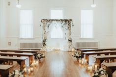 the ceremony room is decorated with candles and flowers