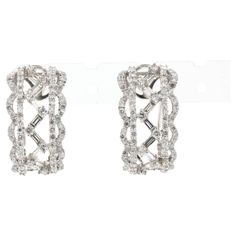 These stunning earrings exude sophistication, meticulously crafted from 18K white gold. The design showcases a captivating interplay of shapes and light, featuring both baguette and round cut diamonds. The baguette diamonds, totaling 0.41 carats, are celebrated for their clarity and precision, offering a contemporary aesthetic with their clean lines and step cuts. They form an elegant lattice, creating a sense of depth and structure within the design. Accentuating this geometric elegance are the Baguette Diamonds, Straight Edges, Sparkle Earrings, Diamond Hoop Earrings, Contemporary Aesthetic, Stunning Earrings, Baguette Diamond, Jewelry Earrings Hoops, Showcase Design