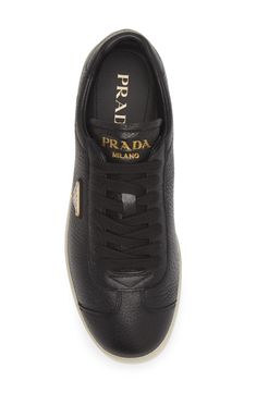 Prada lets the quality star on this sleek low-top sneaker crafted from supple deerskin leather and branded with triangular logo hardware. Lace-up style Leather upper and lining/rubber sole Removable insole Made in Italy Designer Shoes Casual Calf Leather Sneakers With Logo Plaque, Modern Calf Leather Sneakers With Logo Plaque, Luxury Calf Leather Sneakers With Logo Plaque, Leather Sneakers With Logo Plaque And Round Toe, Luxury Leather Sneakers With Logo Plaque, Sporty Black Sneakers With Logo Plaque, Designer Leather Sneakers With Logo Plaque, Sneaker Men, Deer Skin