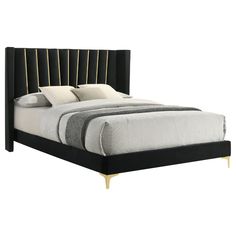 a bed with black and gold headboard and foot board on it's side