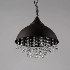 a black chandelier hanging from a ceiling