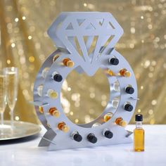 a wine bottle holder made to look like a diamond ring