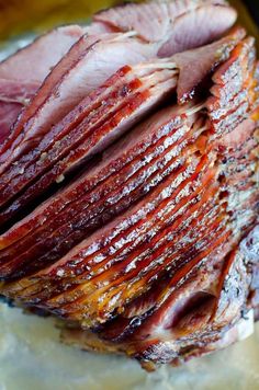 sliced ham sitting on top of a cutting board