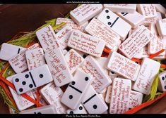 many white buttons with writing on them in a basket