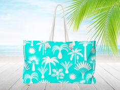 "Blue and white, Tropical palm tree print, Personalized Beach bag with rope handles. Monogram tote bag. Bridesmaid gift, Nautical tote bag, Weekender Travel bag 24\"x 13\"x 5\". It's a carry all bag, a baby bag, or a carry on bag for vacation. Personalized tote bag with a Nautical aesthetic. Free Shipping* Bridesmaid proposal gift or wedding gift. Rope handles are 27\" long and fed though gold color metal grommets. Lightweight and packable our large beach tote is perfect for your weekend at the Green Poolside Bags For Beach Season, Tropical Rectangular Beach Bag, Rectangular Canvas Gift Bag For Beach, Tropical Rectangular Bag For Beach Season, Rectangular Tropical Beach Bag, Blue Tropical Rectangular Bag, Tropical Blue Rectangular Bag, Rectangular Canvas Beach Bag With Handles, Vacation Tote Bag For Poolside